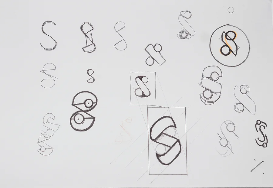 Sketchbook page 11: the S closing into a ring